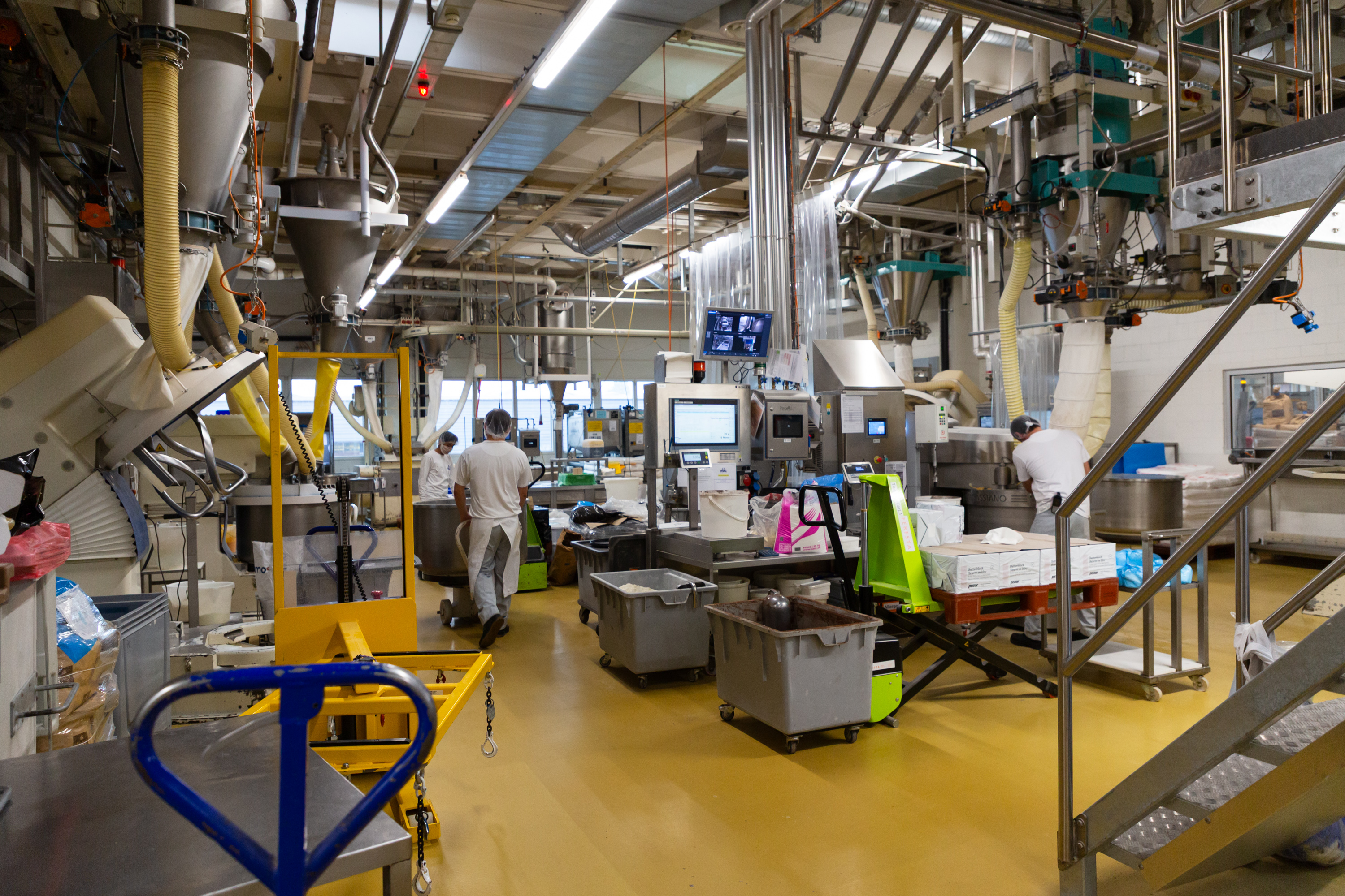 A busy food processing facility with workers