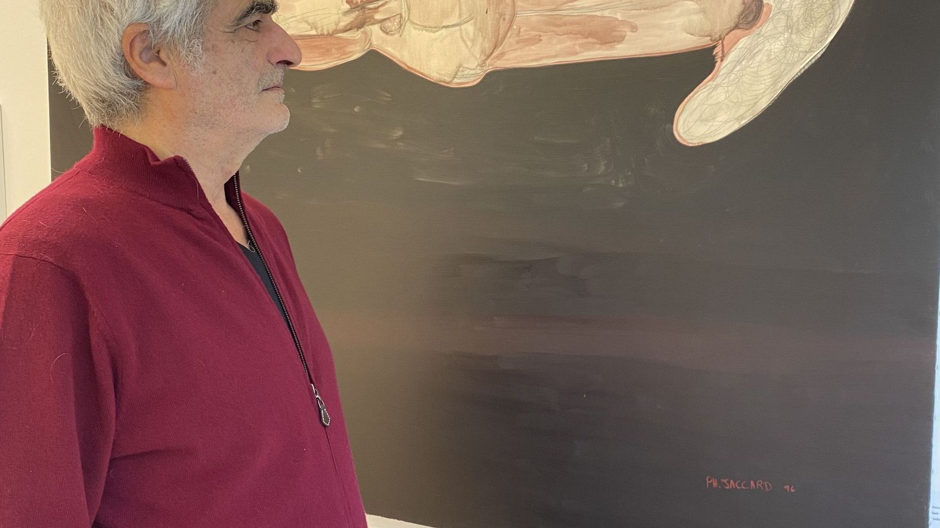 Hervé Perdriolle , founder of the Brussels gallery, in front of a work by Philippe Jaccard