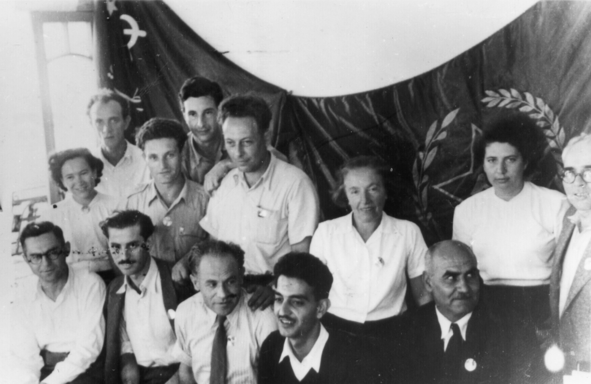 Pnina Feinhaus (standing, the third from the right)) with other members of the Communist Party of Israel in a picture taken in October 1948 in Haifa, Israel. Feinhaus is one of the women interviewed in "Anou Banou" and an active leader of the party until her death.