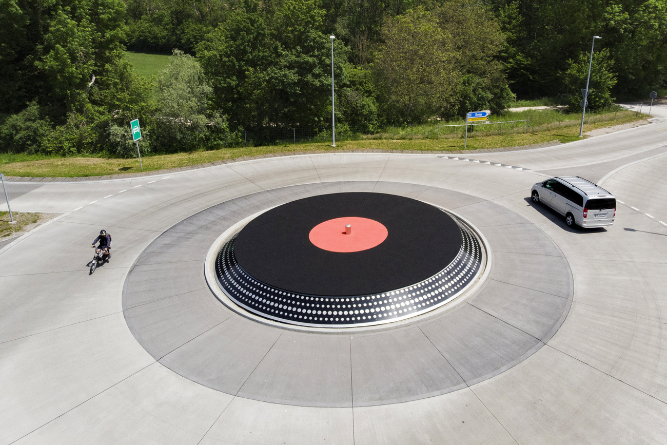 A roundabout seen from above, with a vinyl record in the centre.