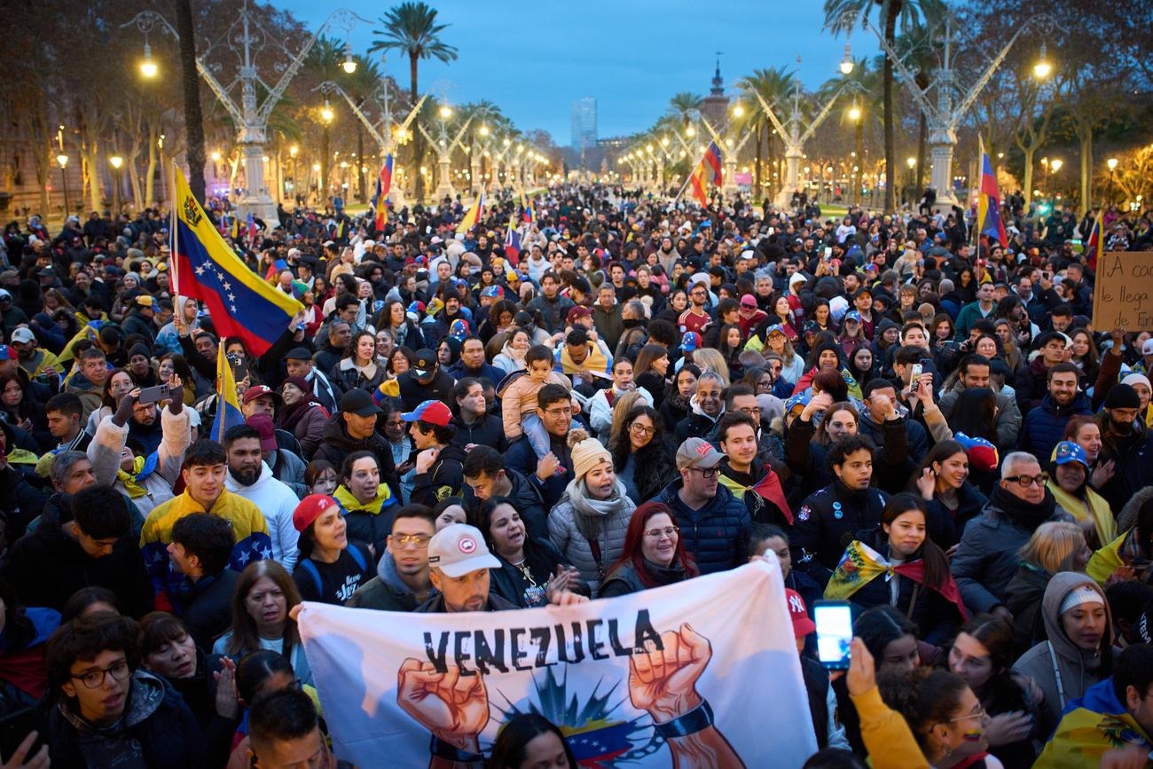 People against Venezuelan President Nicolás Maduro gather in downtown Barcelona, Spain, Sunday, Jan. 4, 2026. (AP Photo/Emilio Morenatti)
