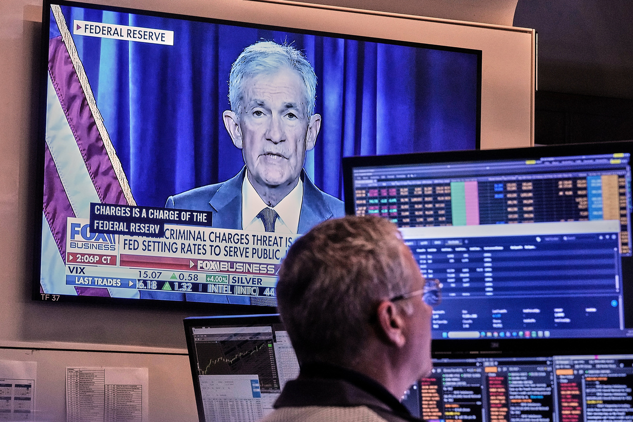 A video of Federal Reserve Chair Jerome Powell plays on a screen on the floor of the New York Stock Exchange on Monday.