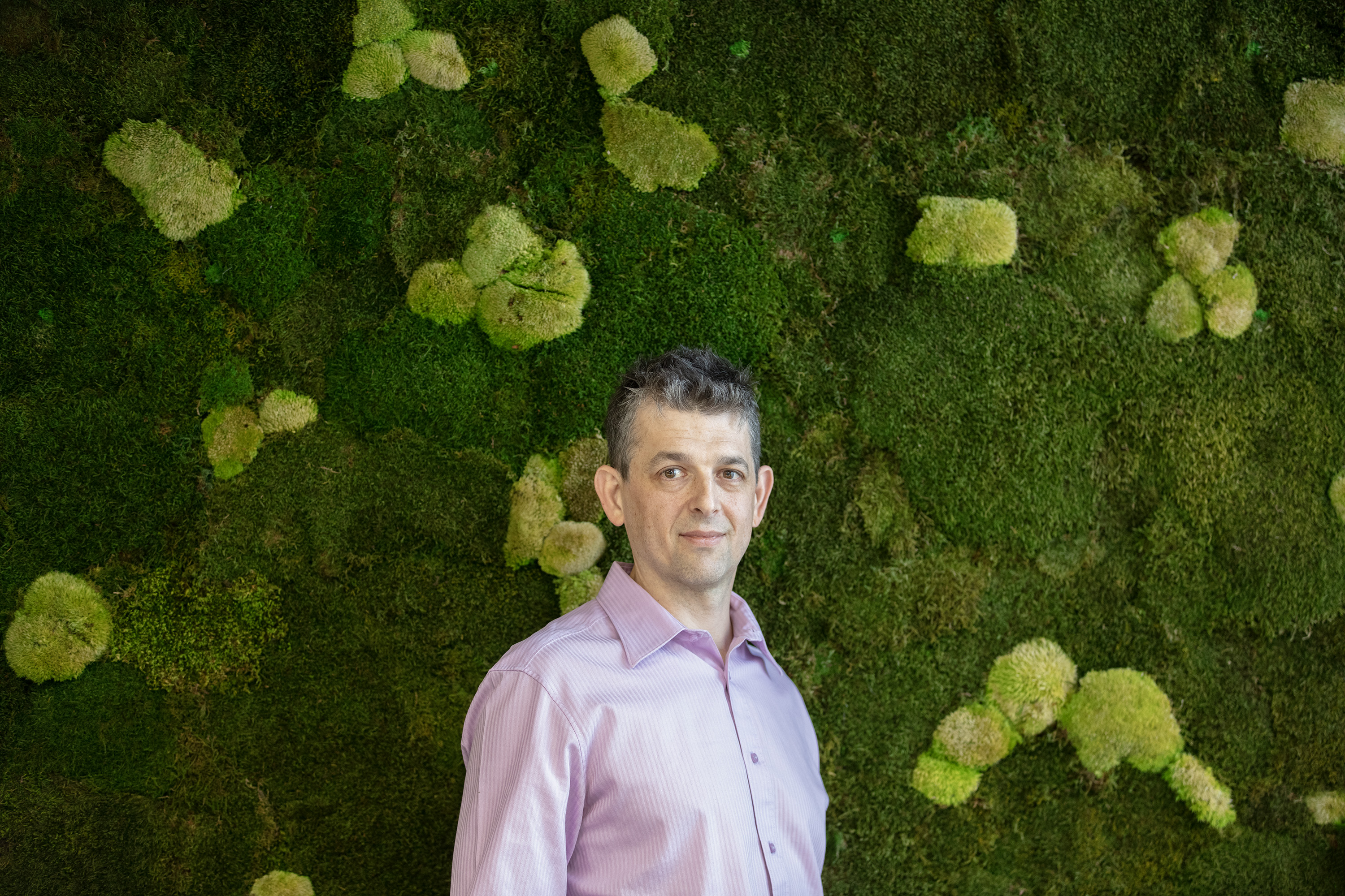 man in front of wall garden