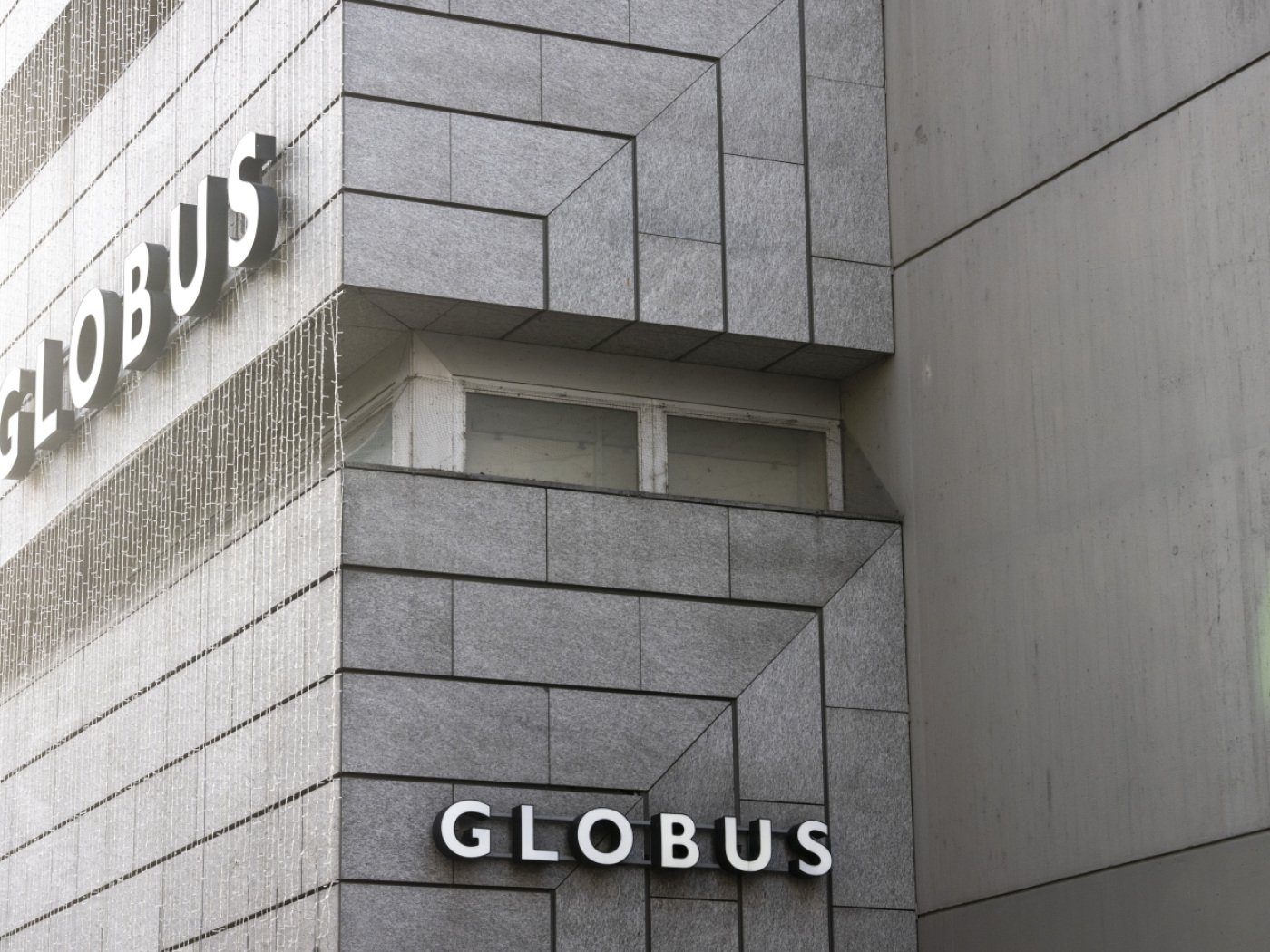 Globus cuts almost 50 jobs at its headquarters