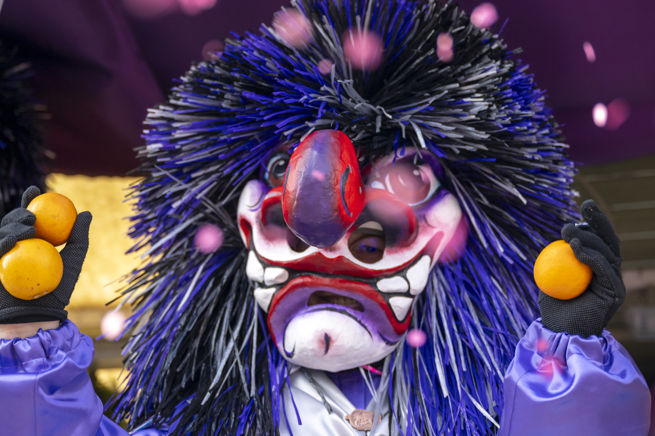 The so-called Waggis are popular figures at the Cortege of the Basel Carnival