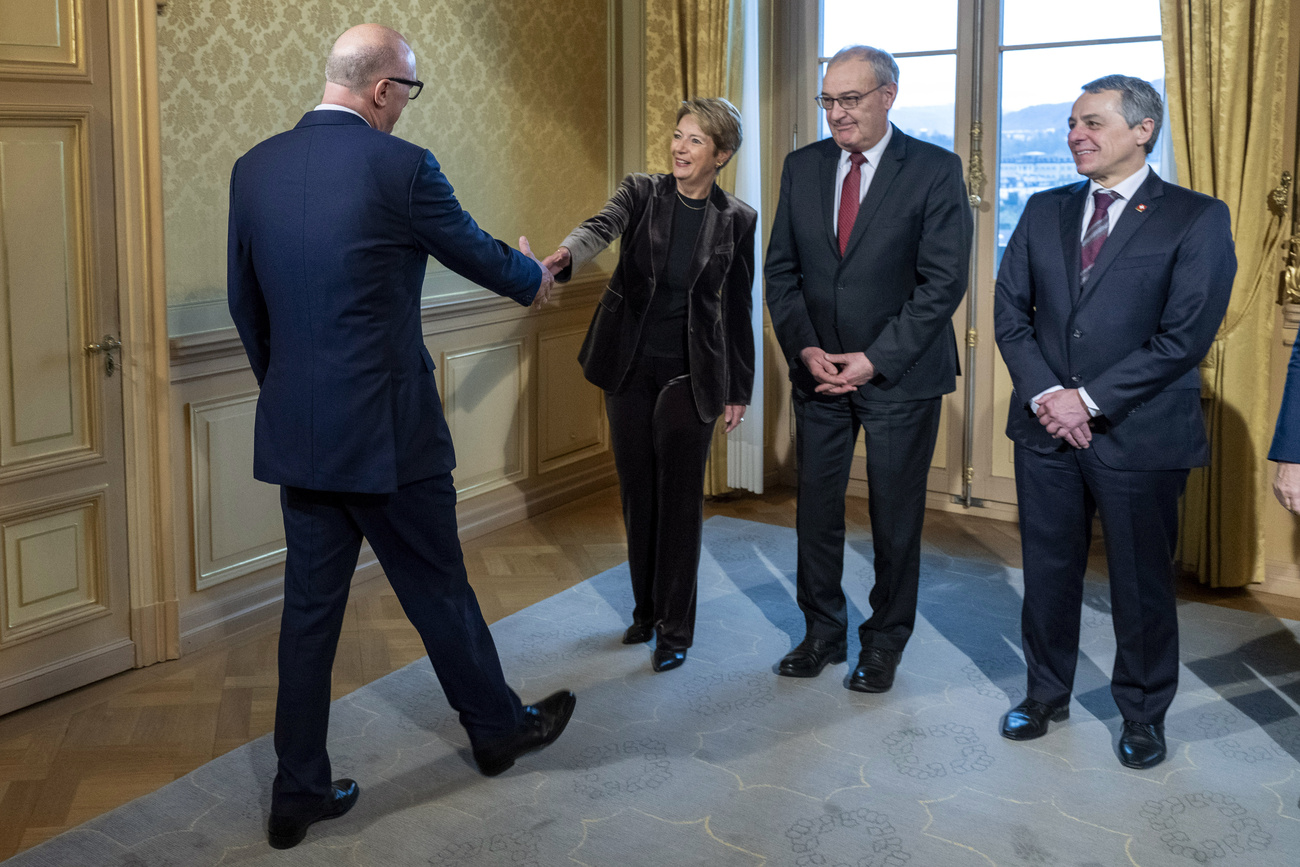 I quattro consiglieri federali denunciati: Martin Pfister, Karin Keller-Sutter, Guy Parmelin e Ignazio Cassis.