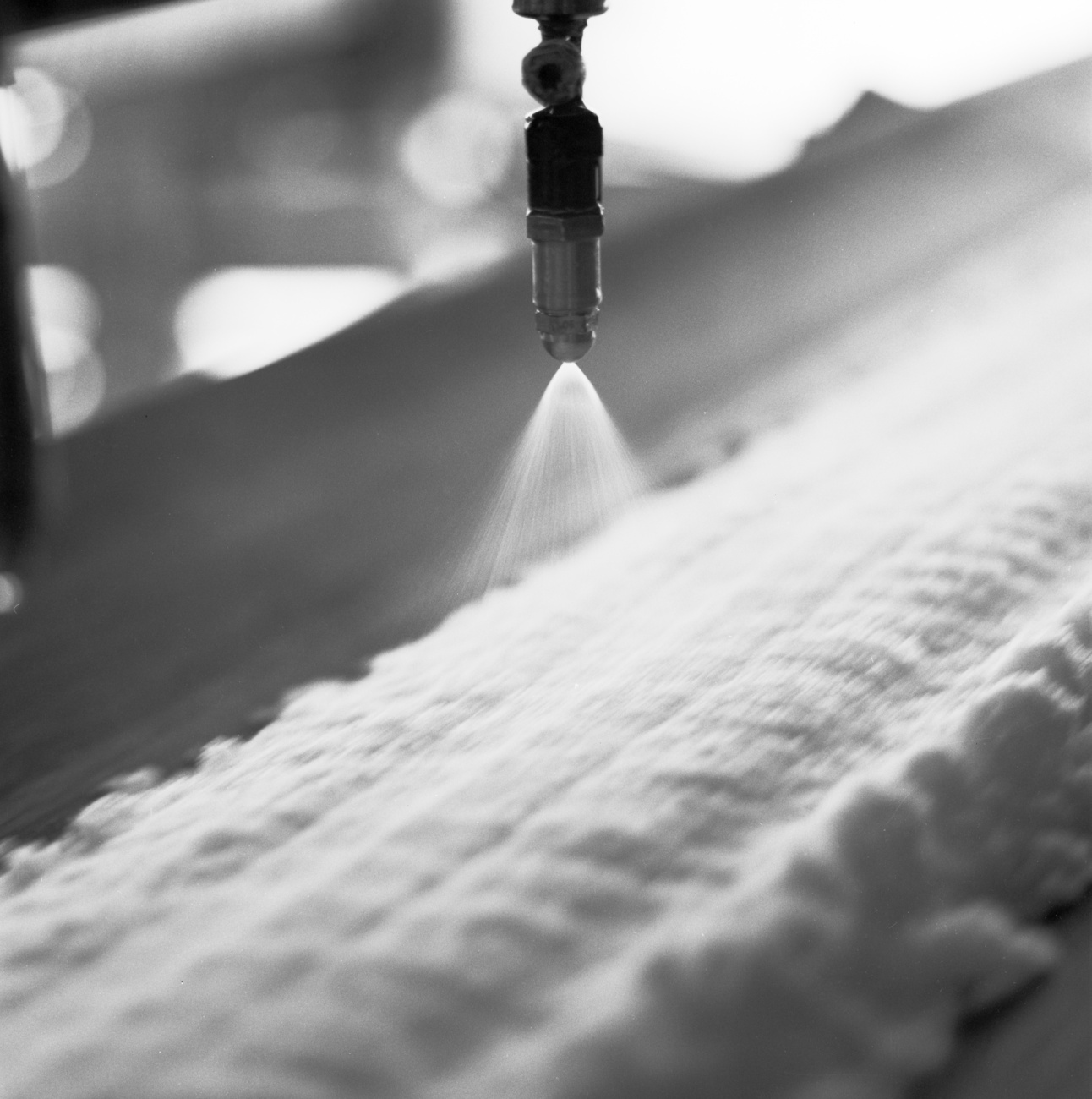 Salt is spread on the conveyor belt