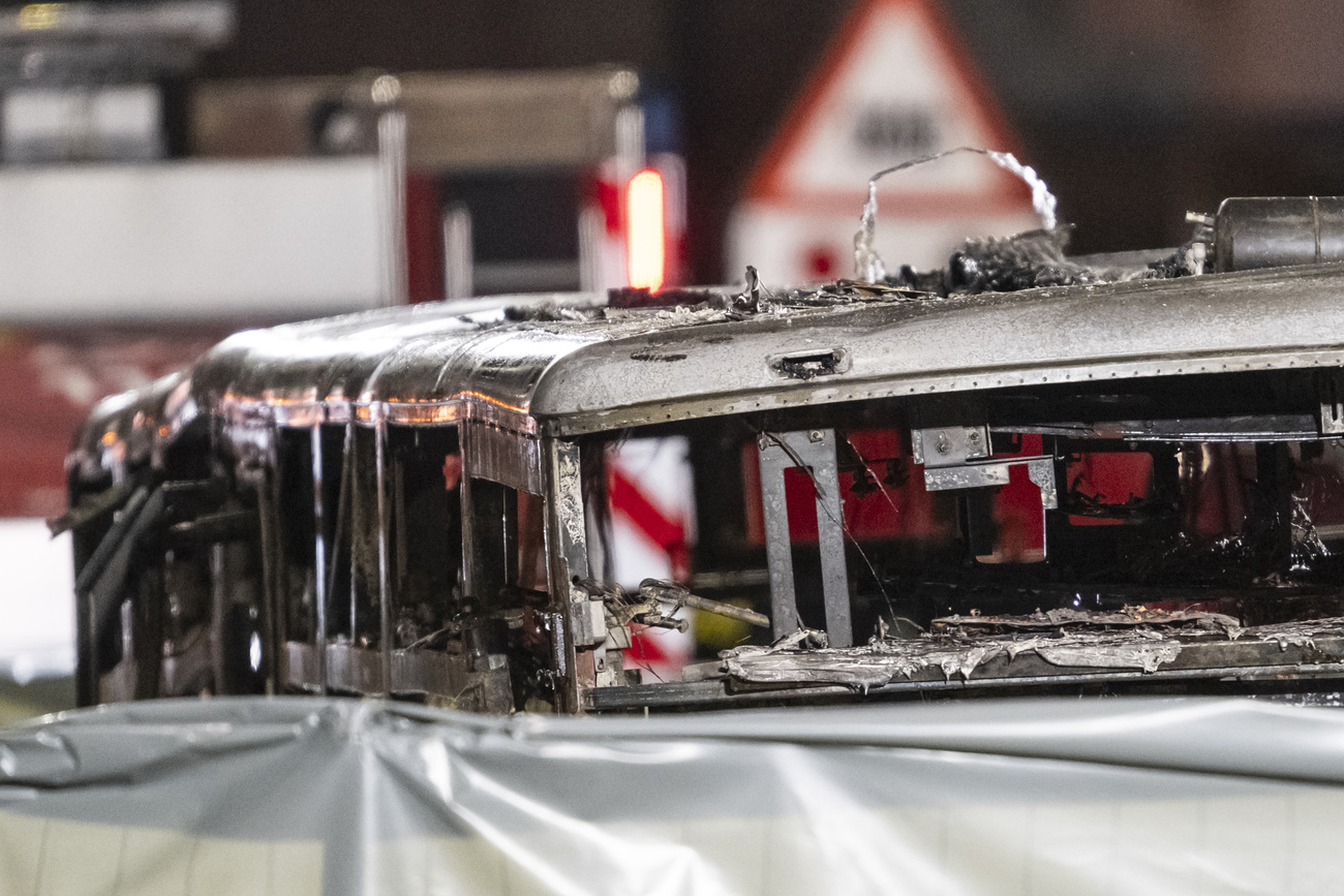 Photo of burnt-out shell of bus.