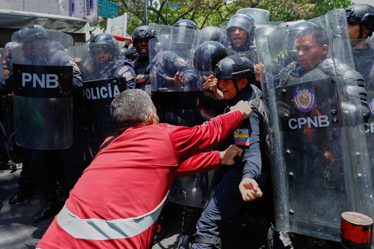 protestor pushing a police officer