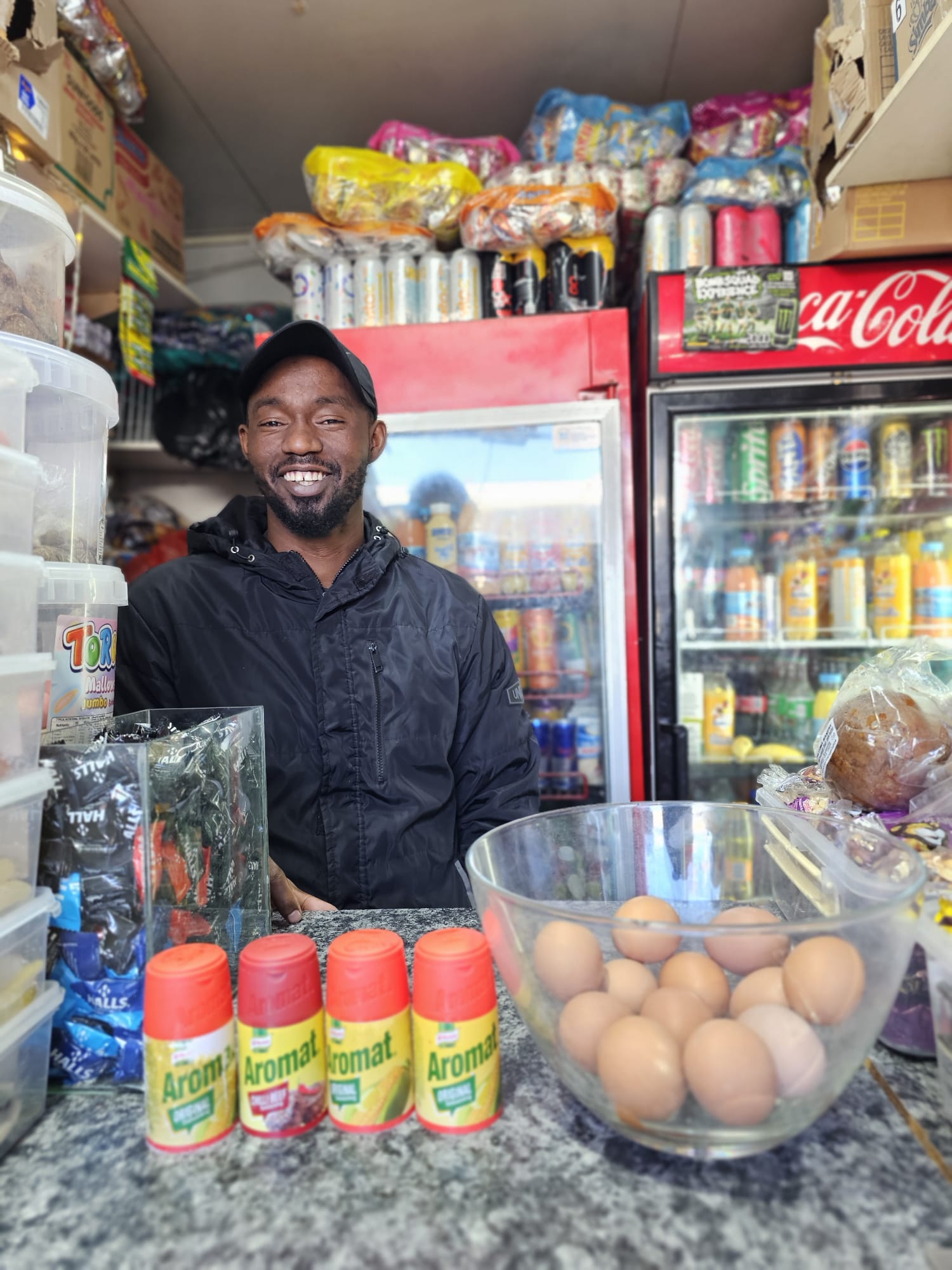 Jibril Mengesha with his display of eggs and spices.