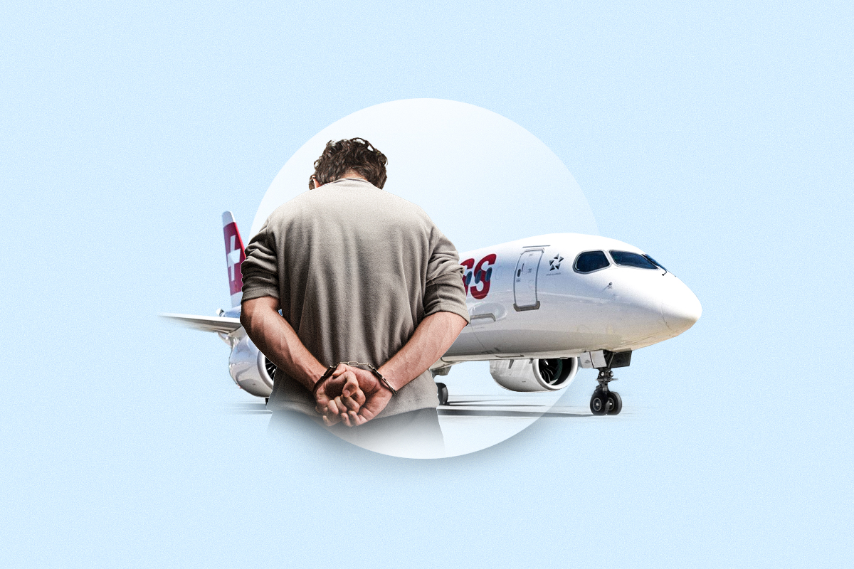 A man in handcuffs in front of a Swiss aircraft