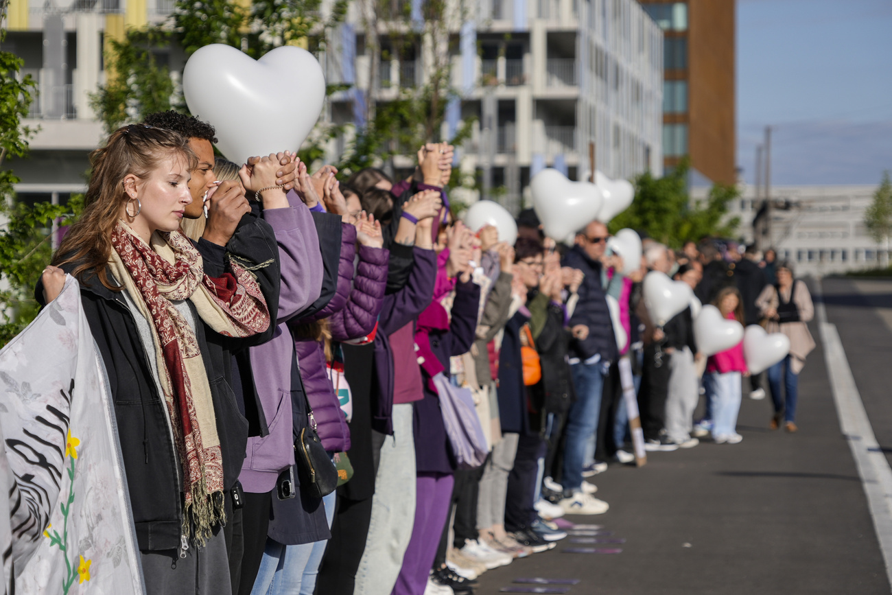 Around 150 people formed a human chain outside the court to protest against feminicide.