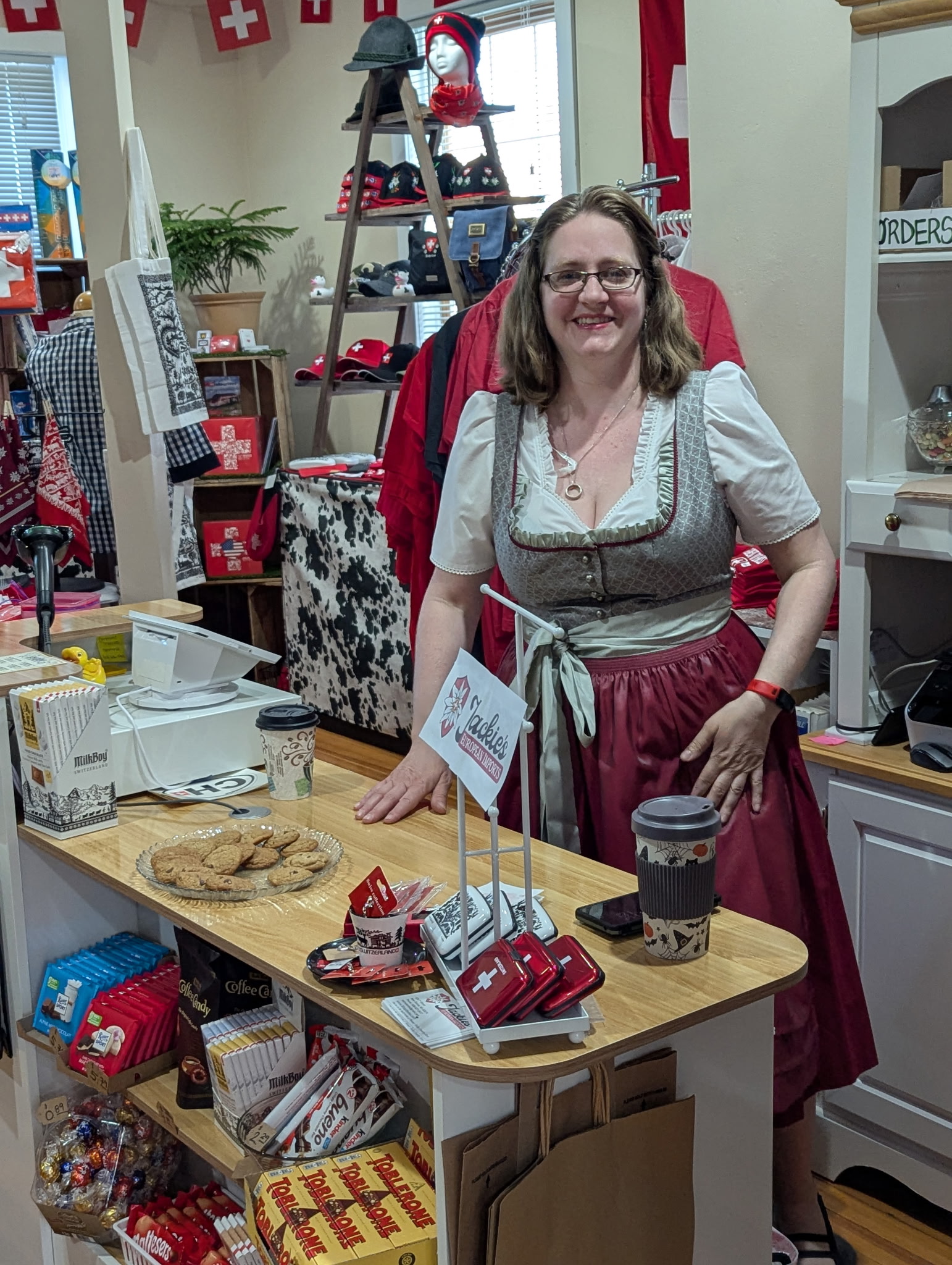 Woman in a dirndl in a souvenir shop