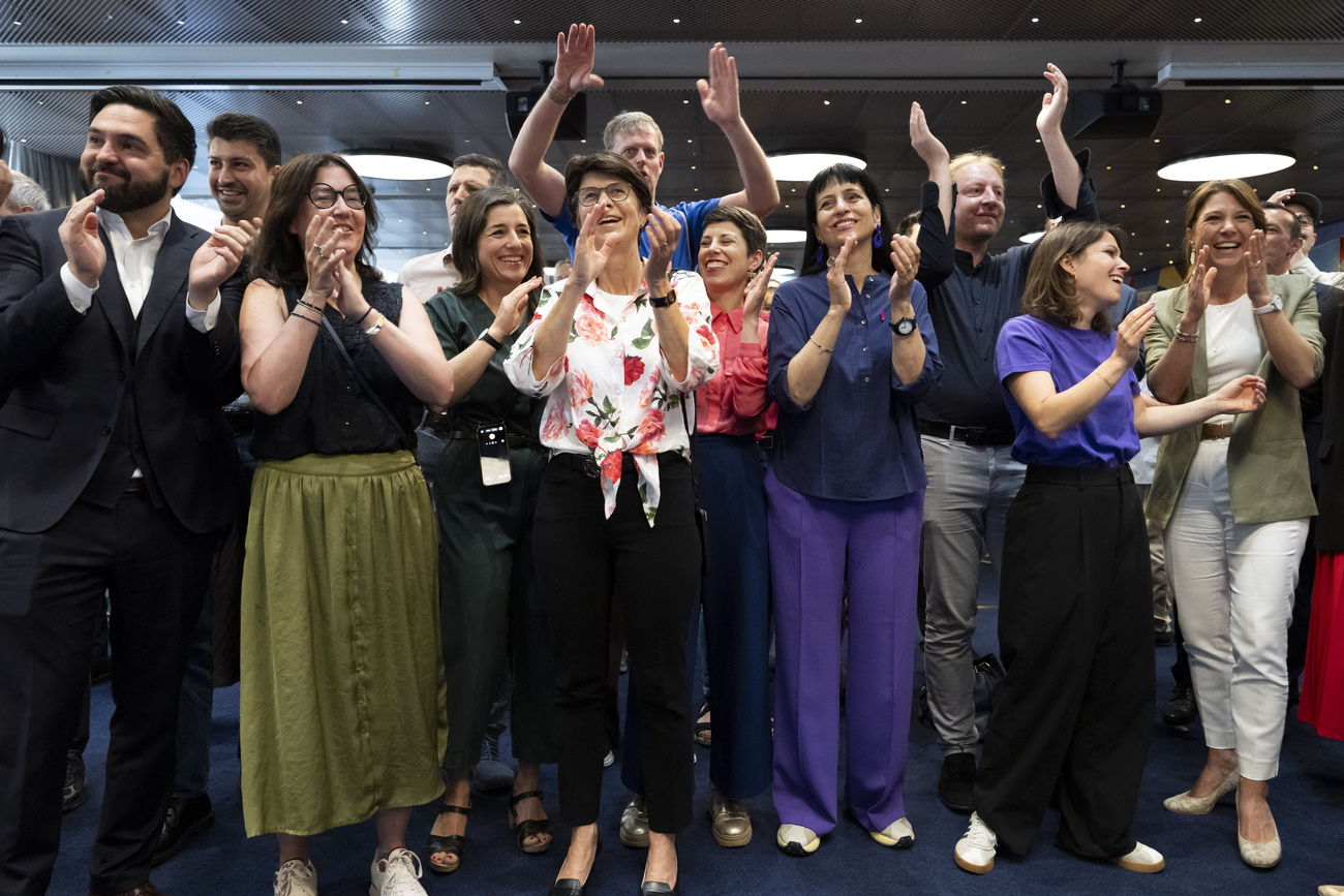 Members of the left-wing Social Democratic Party on Sunday celebrate early projections that show Swiss voters have said "no" to the initiative to cap the population at ten million.