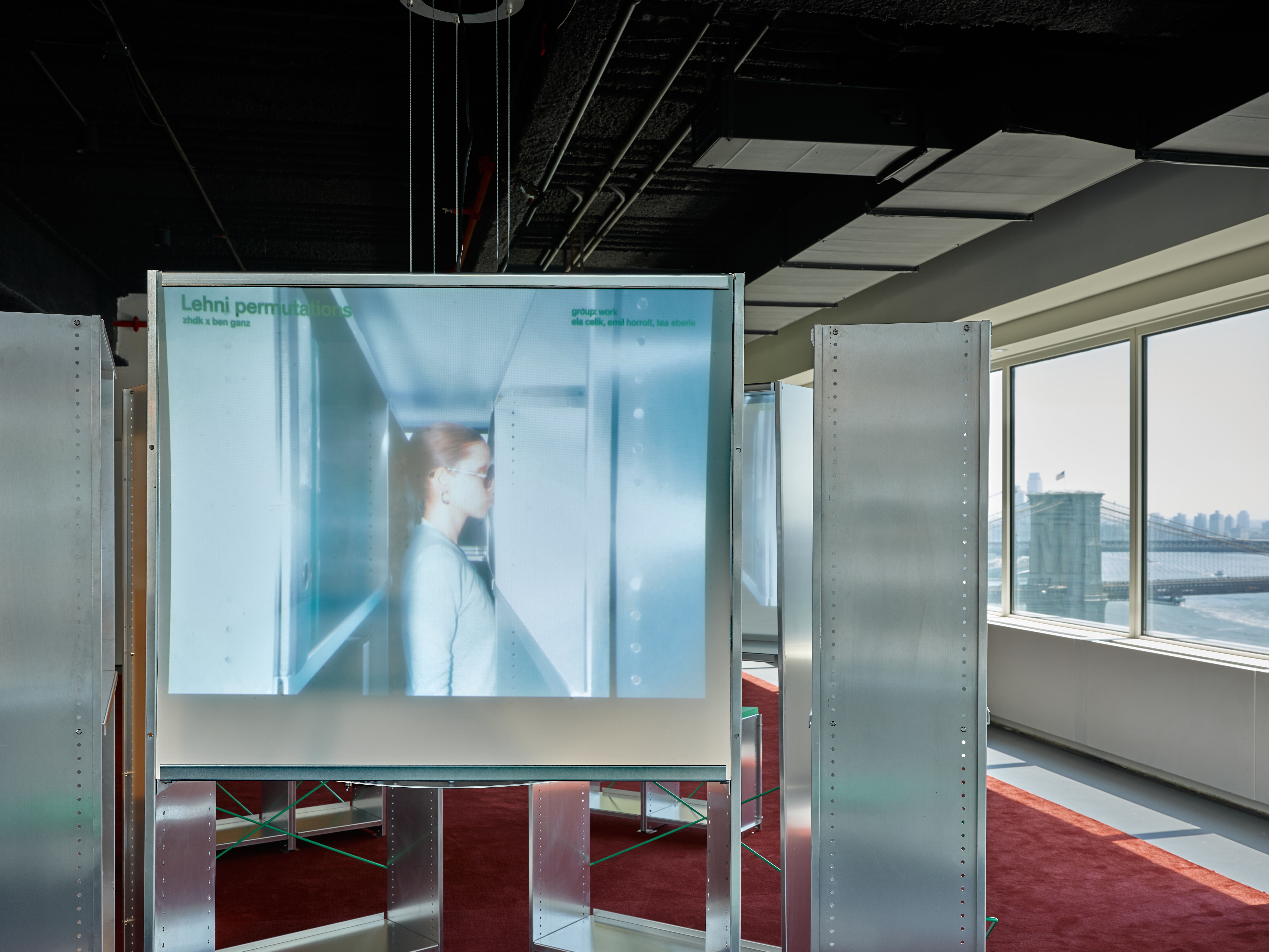 Installation view of the projection structure developed by Ben Ganz using the Lehni «Aluminium Shelf» system. Films from «Permutations» are shown within the shelving units.