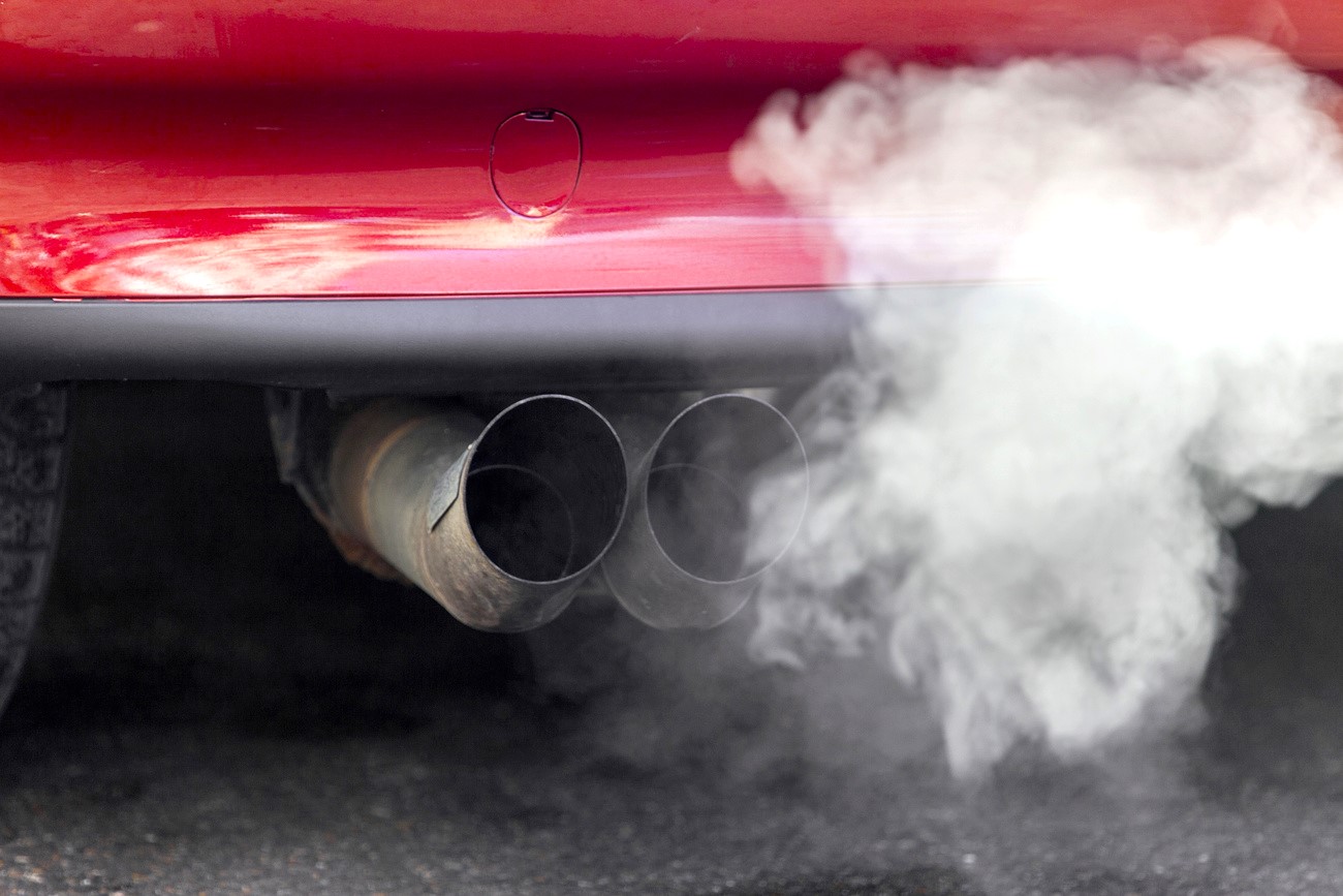 smoke coming out of a car’s exhaust pipe