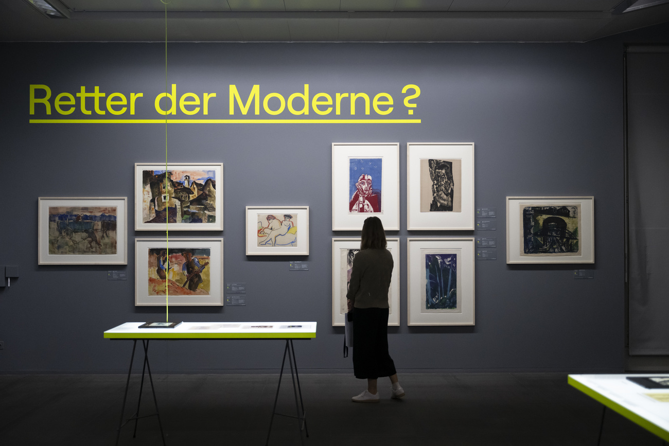 A woman views works from the Gurlitt bequest during the preview of the exhibition “Gurlitt – Taking Stock” (2022). The works document art looting and trade during the Nazi era and aims to provide answers regarding provenance research and the challenges involved in dealing with the research findings.
