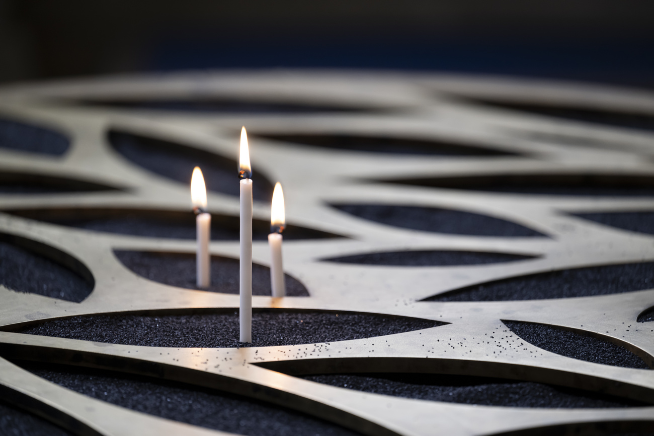 Three candles in a church