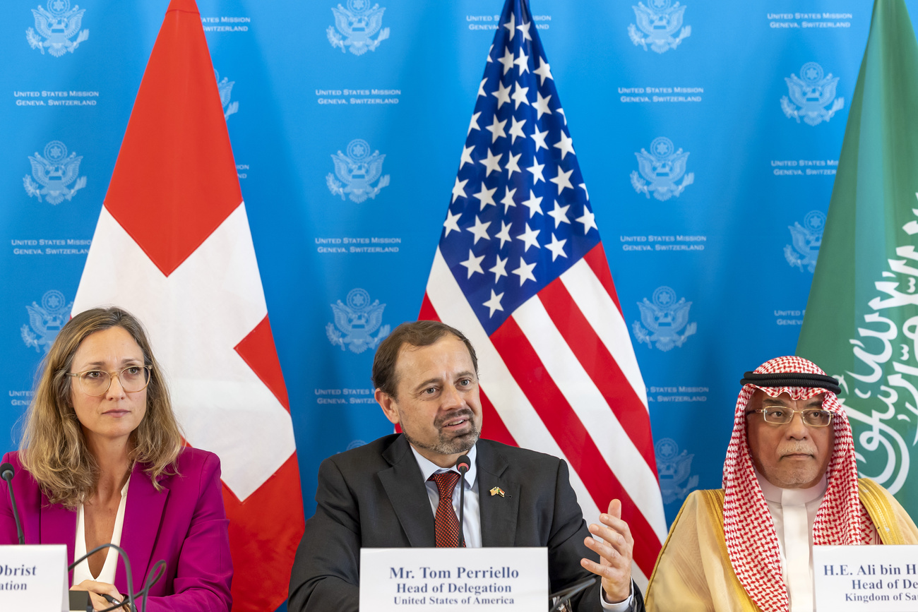 U.S. Special Envoy for Sudan Tom Perriello, centre, sitting between Head of Swiss Delegation Sibylle Obrist, left, and head of Saudi Arabian delegation Ali bin Hassan Jafar, right, talks to the media after a round of the talk aimed at a cessation of hostilities in Sudan during a new press briefing at the U.S. Mission in Geneva, Switzerland, Friday, August 23, 2024.