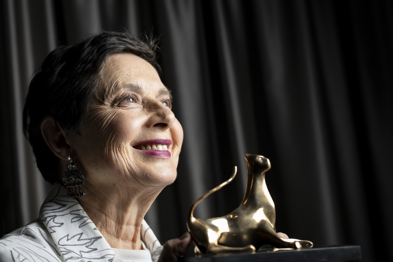 Isabella Rossellini holding her "Excellence Award 2026" at the 79th Locarno Film Festival.