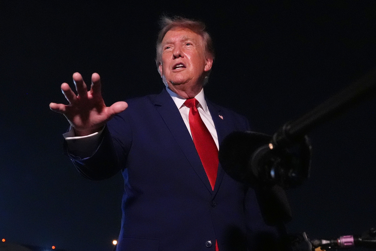 Donald Trump talks to reporters after arriving on Air Force One in Maryland on Tuesday.