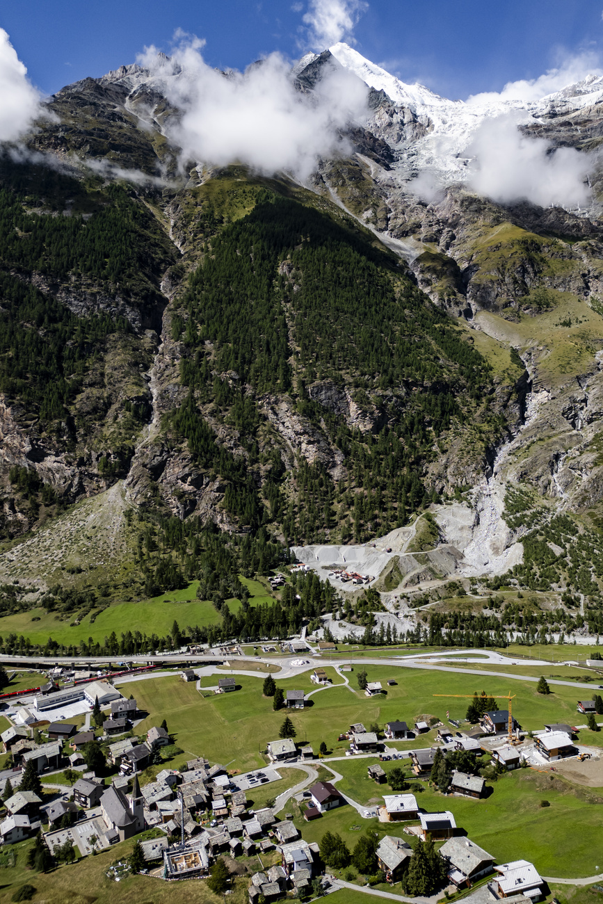 A view from the summit of the Weisshorn mountain with the Weisshorn East hanging glacier (left) above the Bisgletscher and, below, the village of Randa, south of Zermatt in canton Valais.