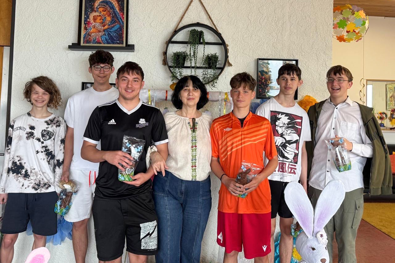 The director of the children’s home with some of the teenage boys in her care.