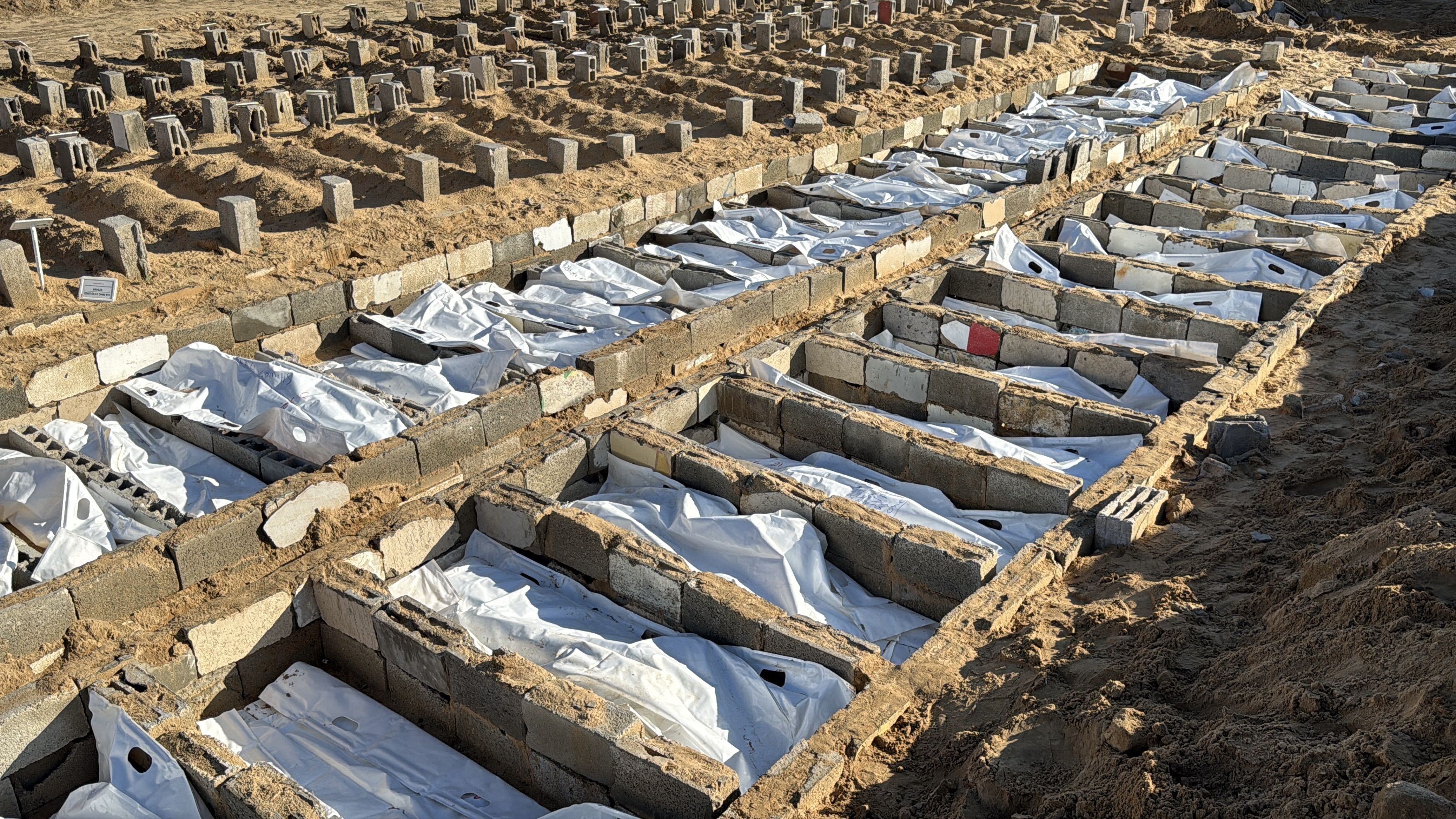 Funeral prayers are held at the Al-Shifa Medical Complex for the bodies of Palestinians