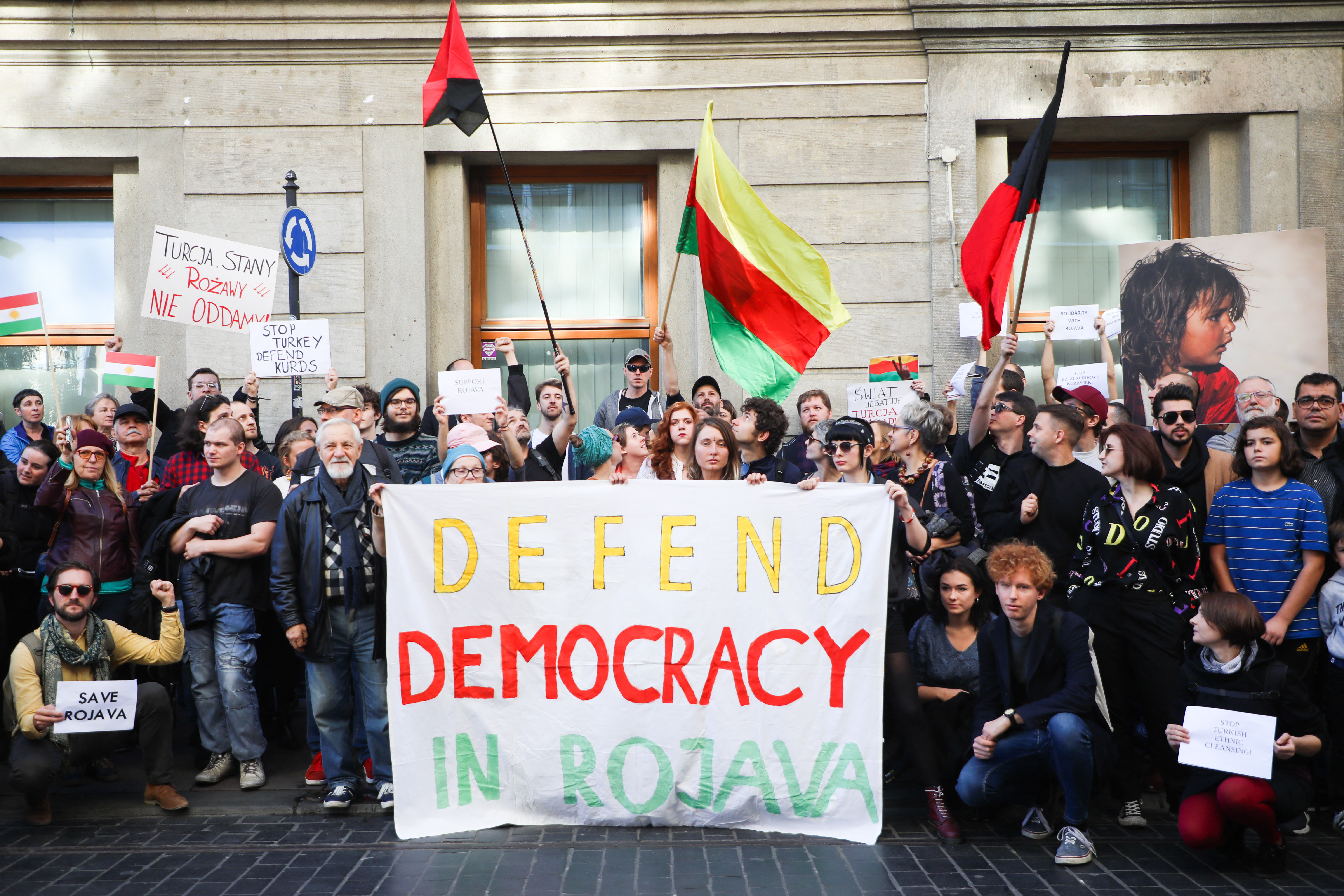 defend democracy in rojava banner