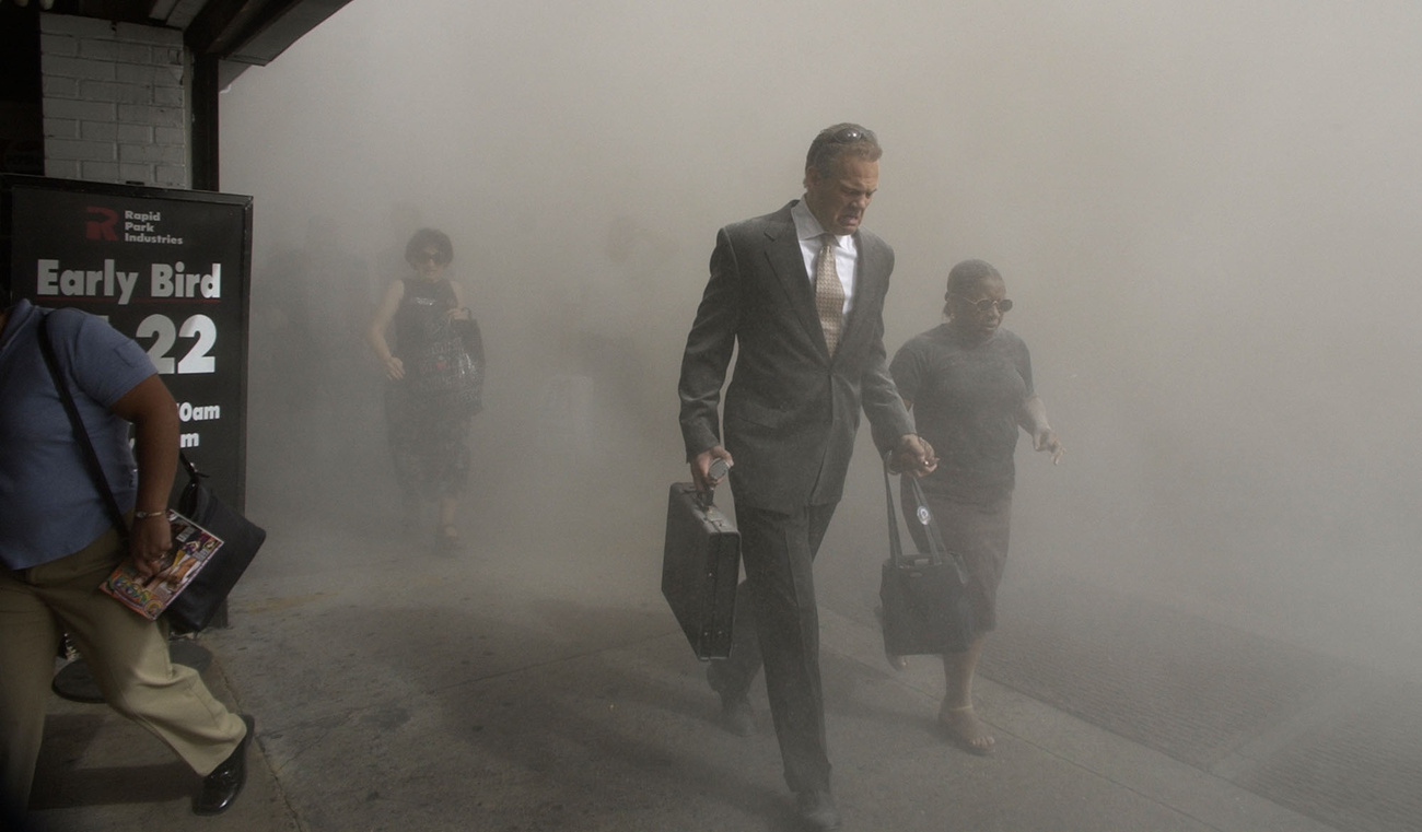 People flee the area of the World Trade Center following the terrorist attack.