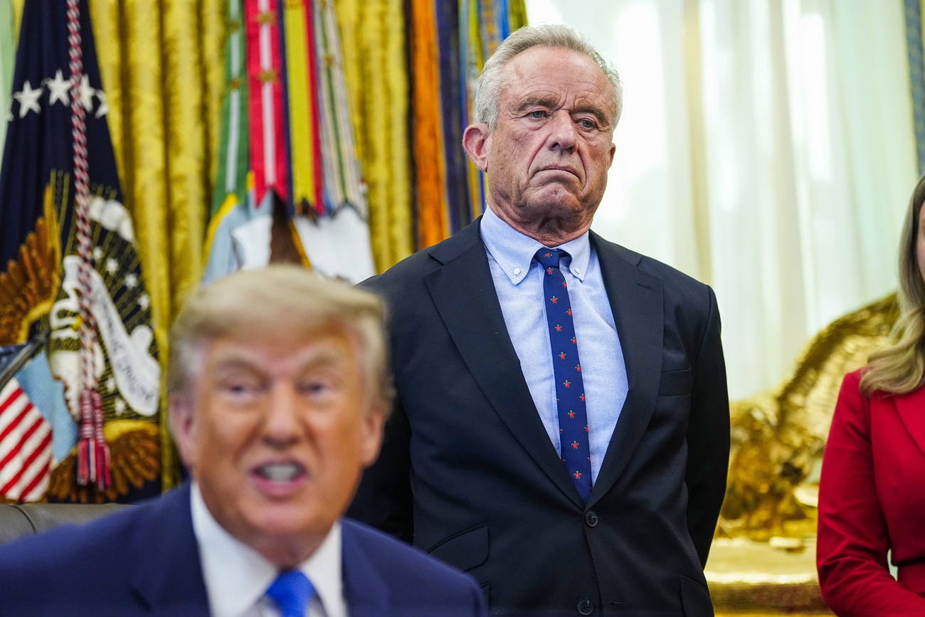 US President Donald Trump speaks as US Health and Human Services Secretary Robert F. Kennedy Jr looks on in the Oval Office last month.