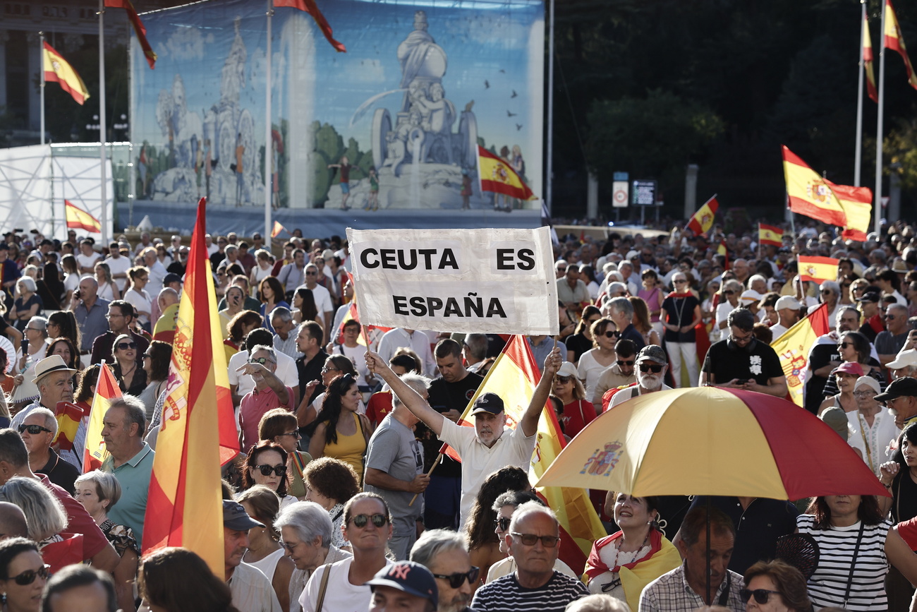 Varias personas participan en una manifestación con motivo del Día de Ceuta y en plena crisis migratoria de Ceuta, en Madrid.