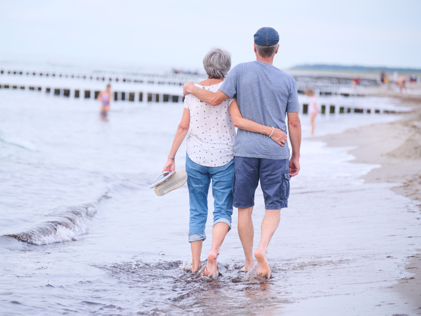 a couple embracing by the sea