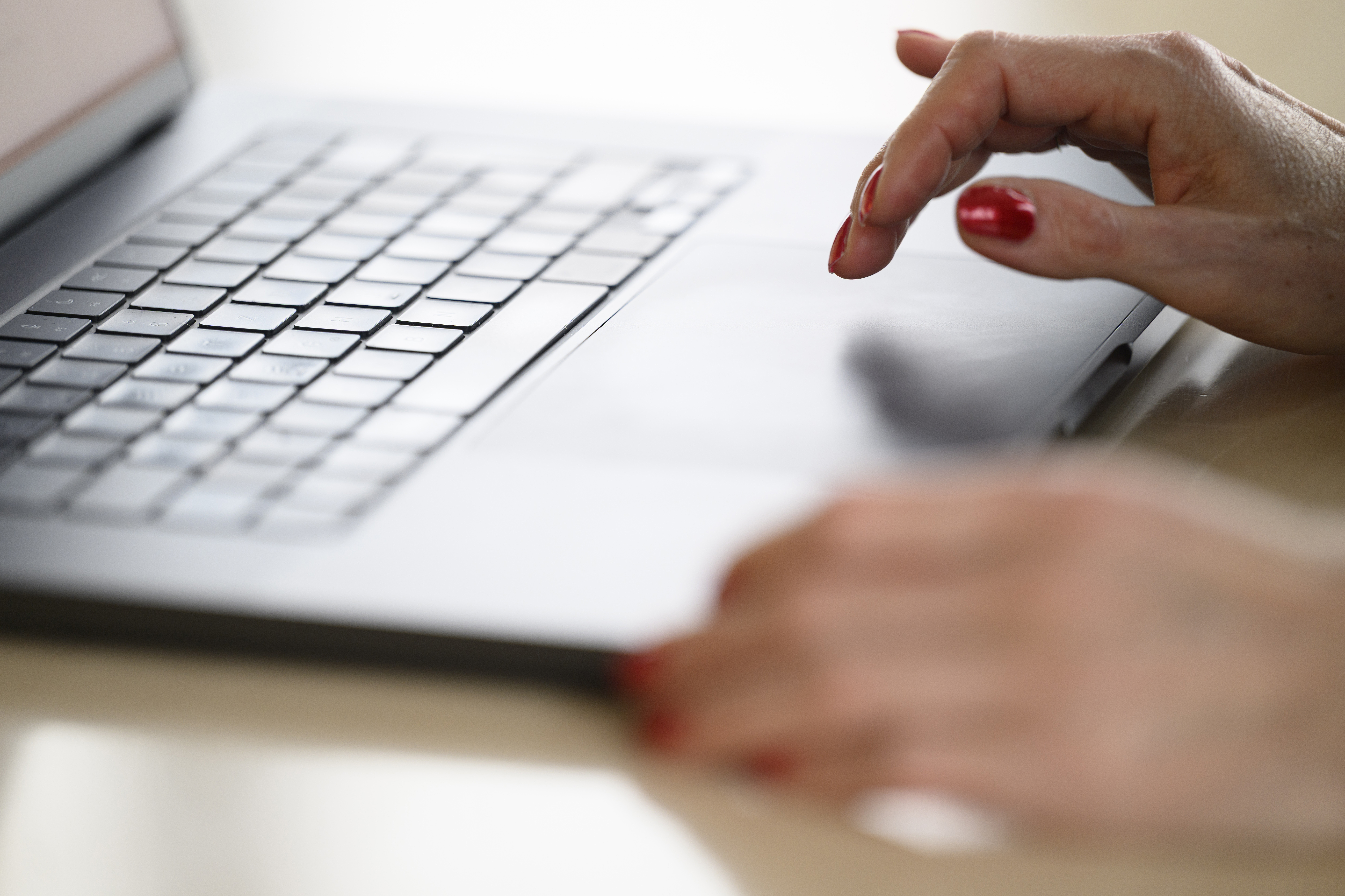 laptop and hand