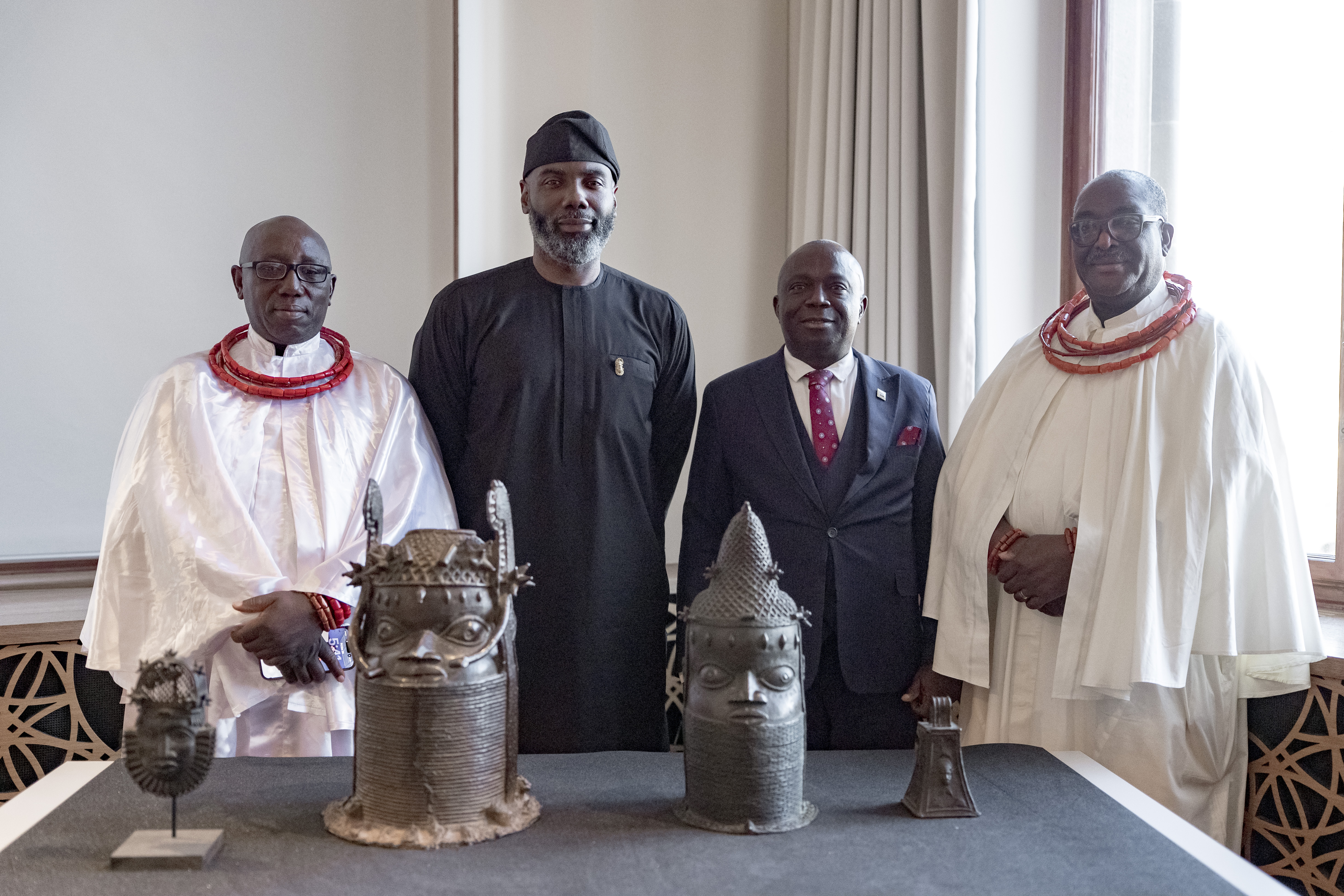 From left: Chief Nosakhare Nelson Agbonifi, the Ebagua of Benin, Olugbile Holloway, Director General Nigeria's National Commission for Museums and Monuments (NCMM), Babatunde Adebiyi (NCMM) and Chief Osas Gabriel Edebor-Asuen, the Obazughanwen of Benin, pose with some of the Benin objects during the ceremony of their transfer of ownership in the townhall in Zurich, 20. March 2026.
