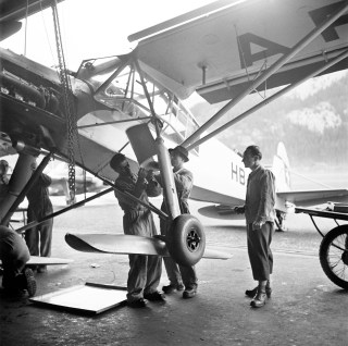 skis being fitted to plane