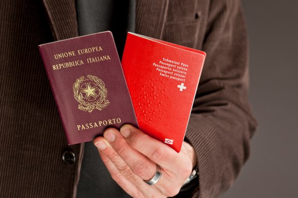 A man holds two passports