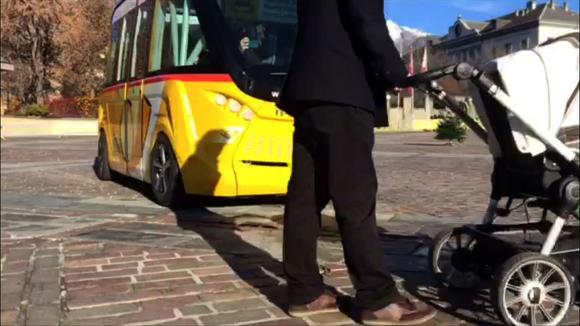 Driverless bus stops for father with pushchair