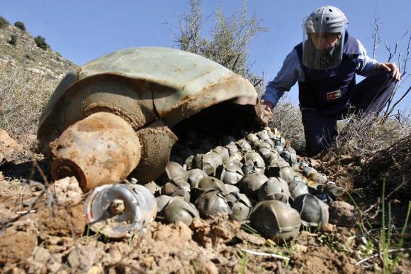 inspecting a Cluster Bomb Unit in the southern village of Ouazaiyeh, Lebanon, Thursday, Nov. 9, 2006