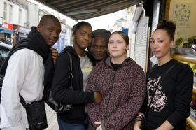 A racially mixed group of young people in the streets
