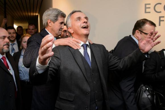 Secretary of State John Kerry, left, jokes with Swiss Minister of Foreign Affairs Didier Burkhalter at WEF