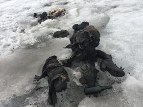 mummified remains of two people in glacier