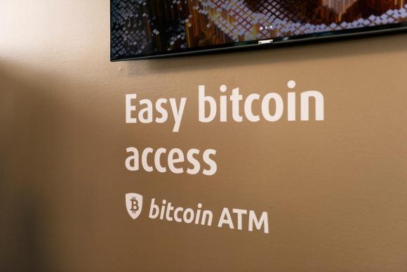 A bitcoin ATM with a sign reading: Easy bitcoin access