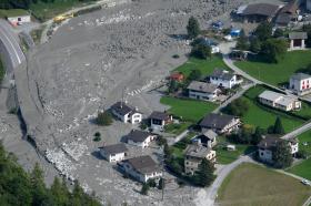 Mud rushes towards the village after another eruption, in Bondo, Graubuenden in South Switzerland, on Friday, August 25, 2017.