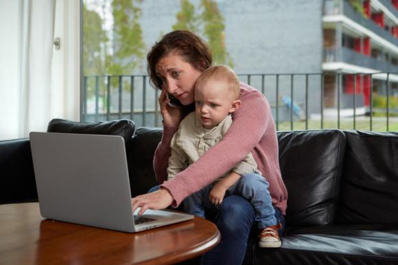 Woman with a laptop and toddler