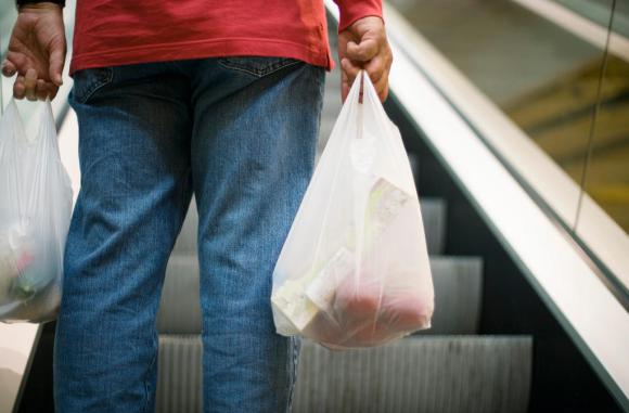Shopper with a plastic bag