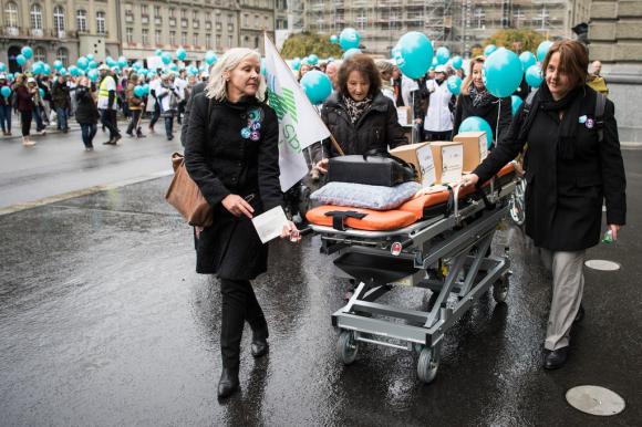 Handing in the signatures for a nursing initiative