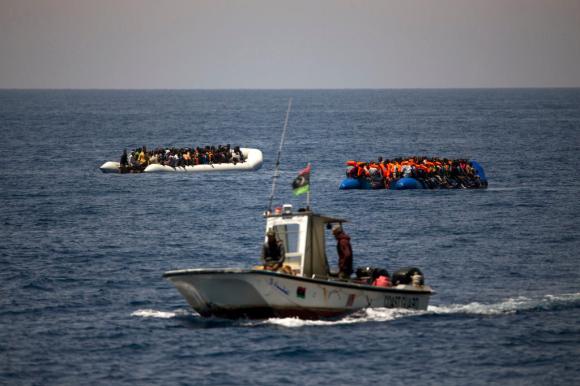migrants in boats near Libyan coast