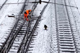 Man fixing a rail track