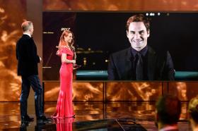 Roger Federer on a screen accepting his award